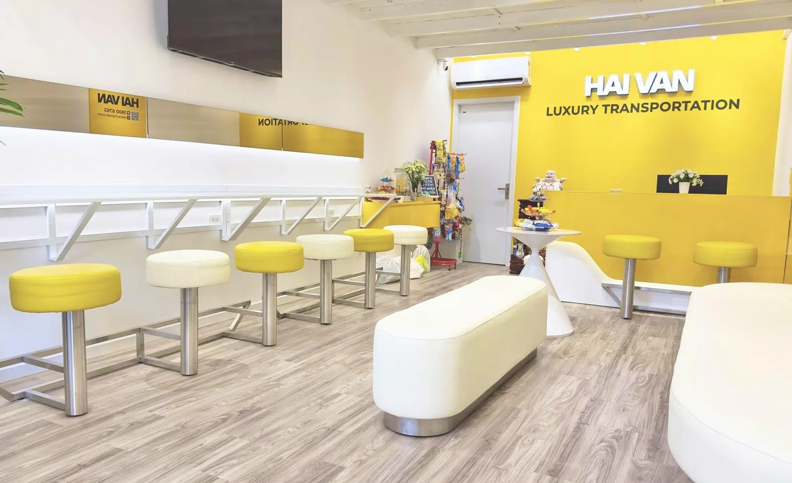 Inside the Hai Van lounge at 34 Nguyen Thai Binh with seating rows and ticket counter